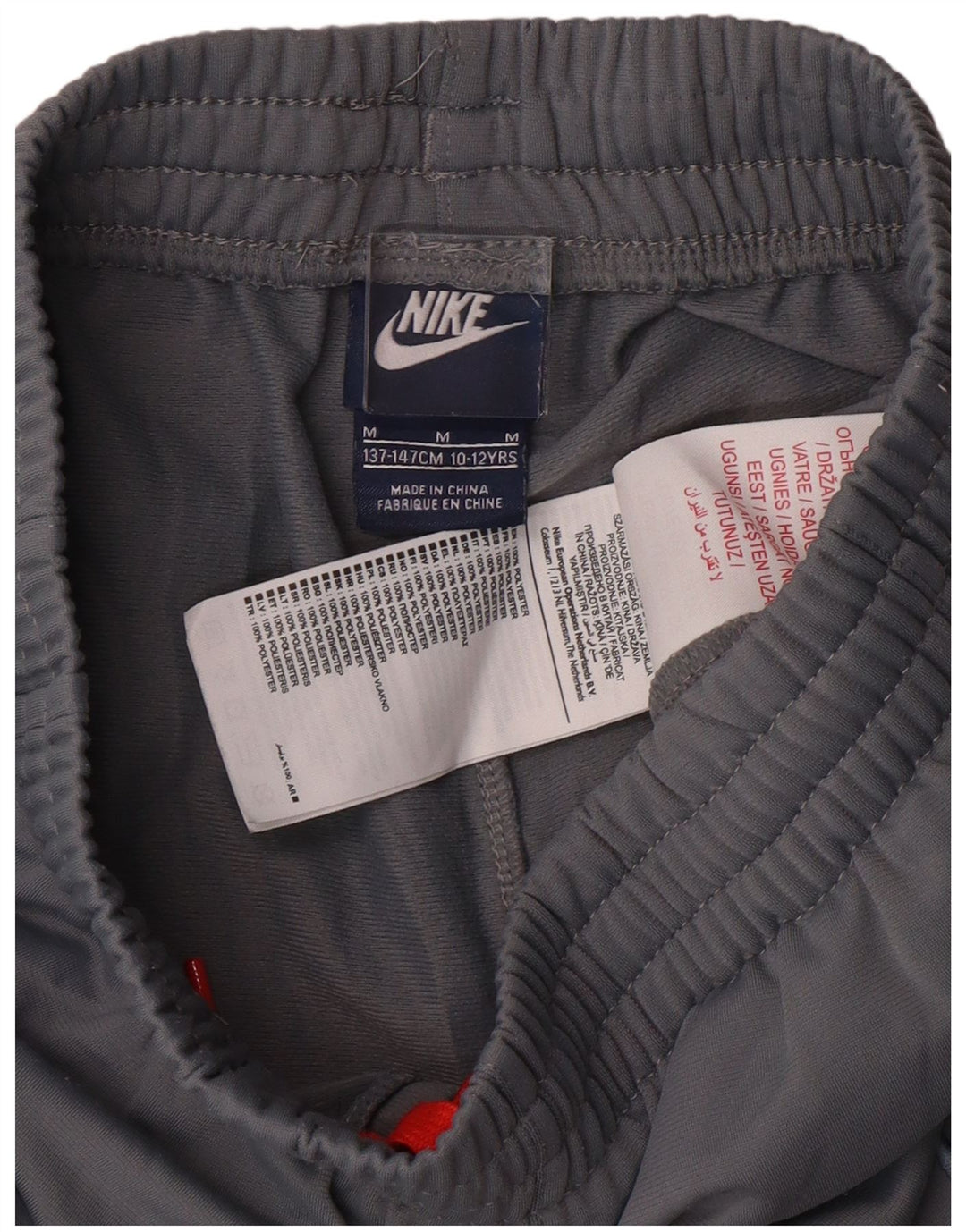 NIKE Boys Tracksuit Trousers 10-11 Years Medium Grey Polyester