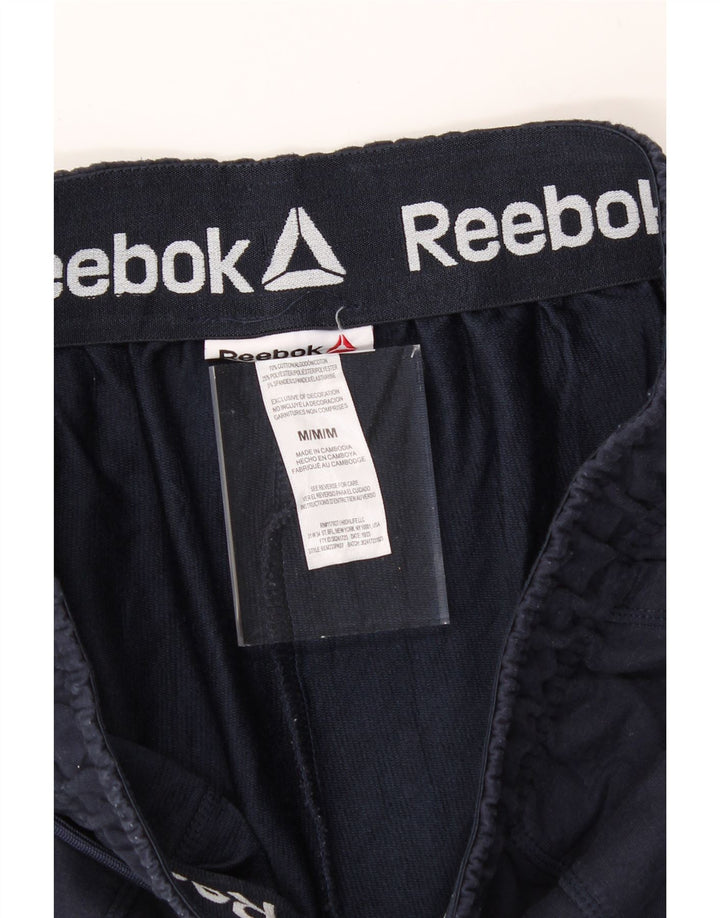 REEBOK Mens Tracksuit Trousers Joggers Medium  Navy Blue Cotton Vintage Reebok and Second-Hand Reebok from Messina Hembry 