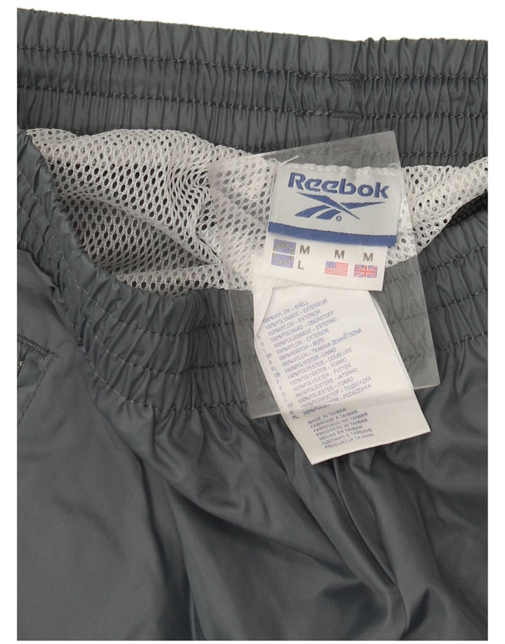 Pantalón de Chándal REEBOK Hombre Gris Medio Poliamida