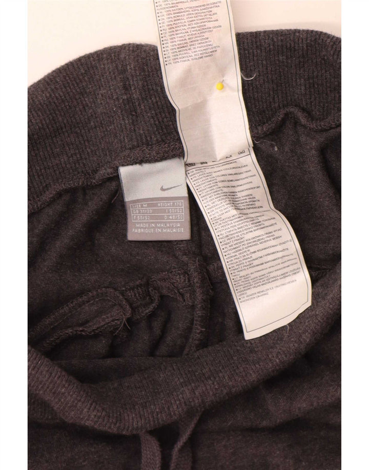 Pantaloni della tuta da donna Nike in cotone grigio medio