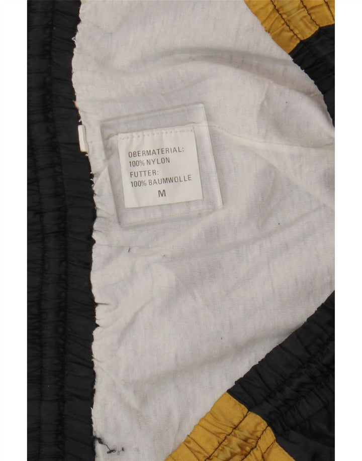 VINTAGE Mens Tracksuit Trousers Medium  Black Colourblock Nylon Vintage Vintage and Second-Hand Vintage from Messina Hembry 