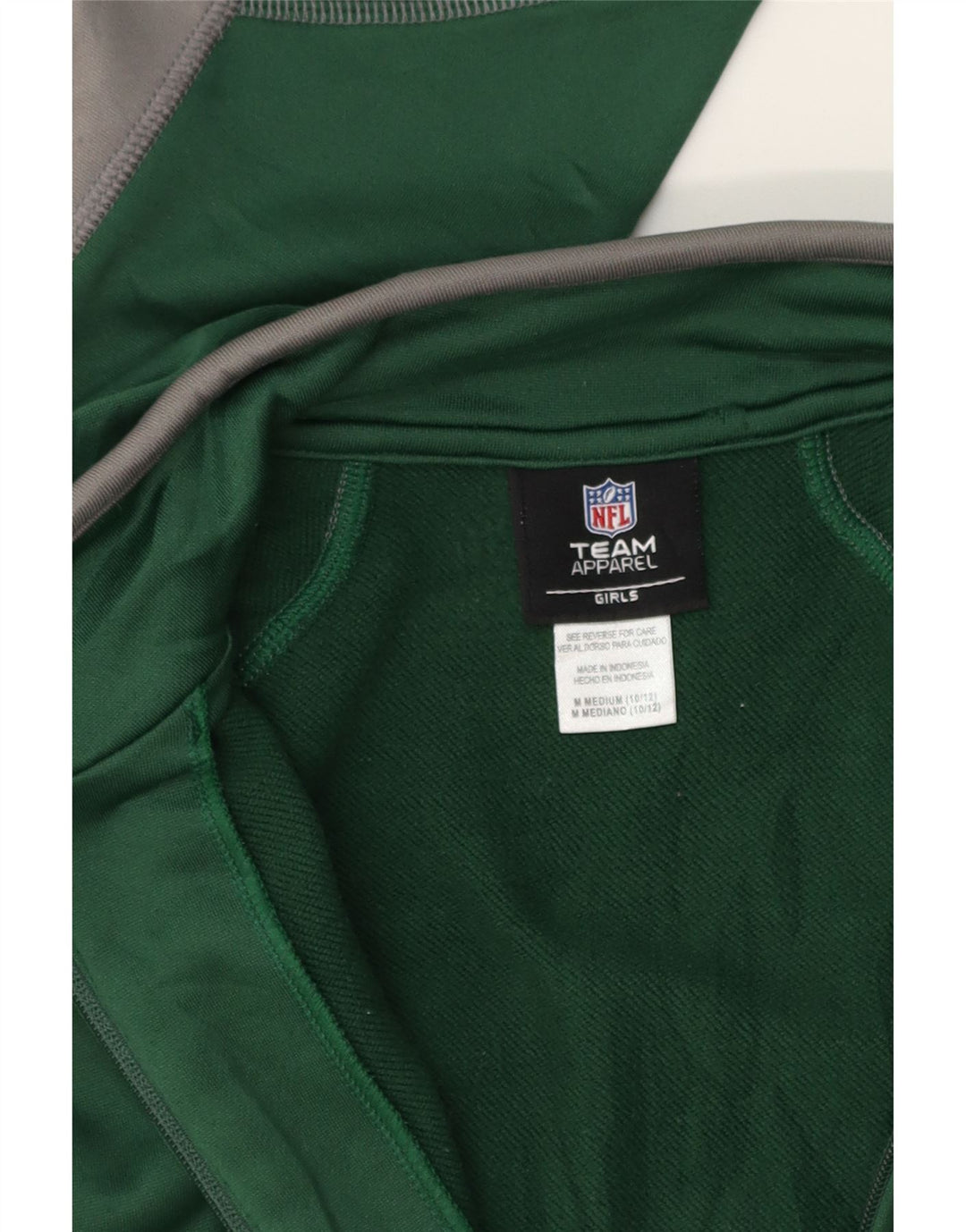 NFL TEAM APPAREL Girls Tracksuit Top Jacket 10-11 Years Medium Green Vintage NFL TEAM APPAREL and Second-Hand NFL TEAM APPAREL from Messina Hembry 